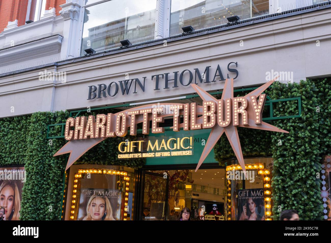 Ireland Eire Dublin Grafton Street iconic landmark Brown Thomas luxury retail department store with Charlotte Tilbury cosmetics gift magic promotion Stock Photo