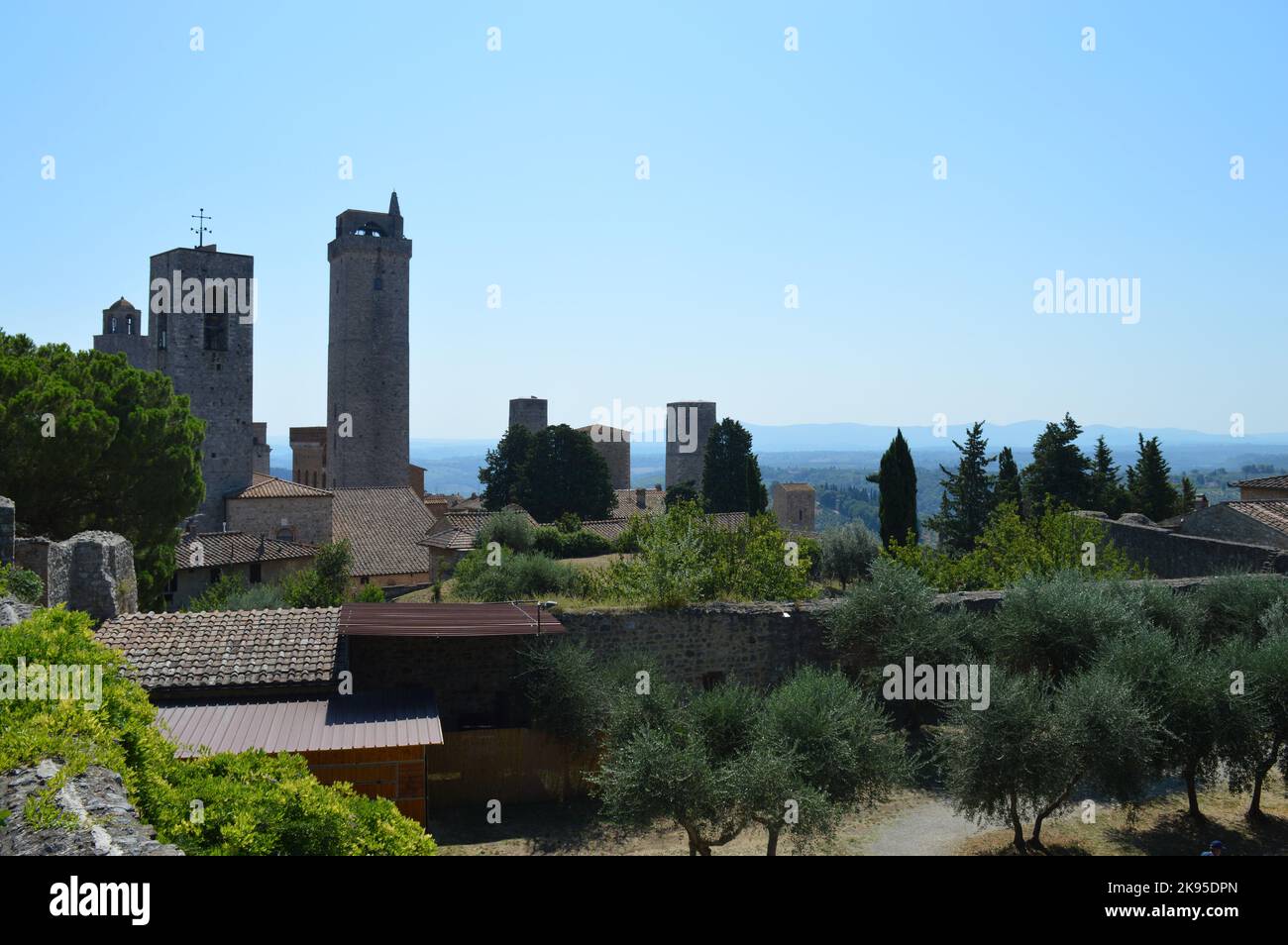 San Gimignano, view on tower houses and olive trees Stock Photo