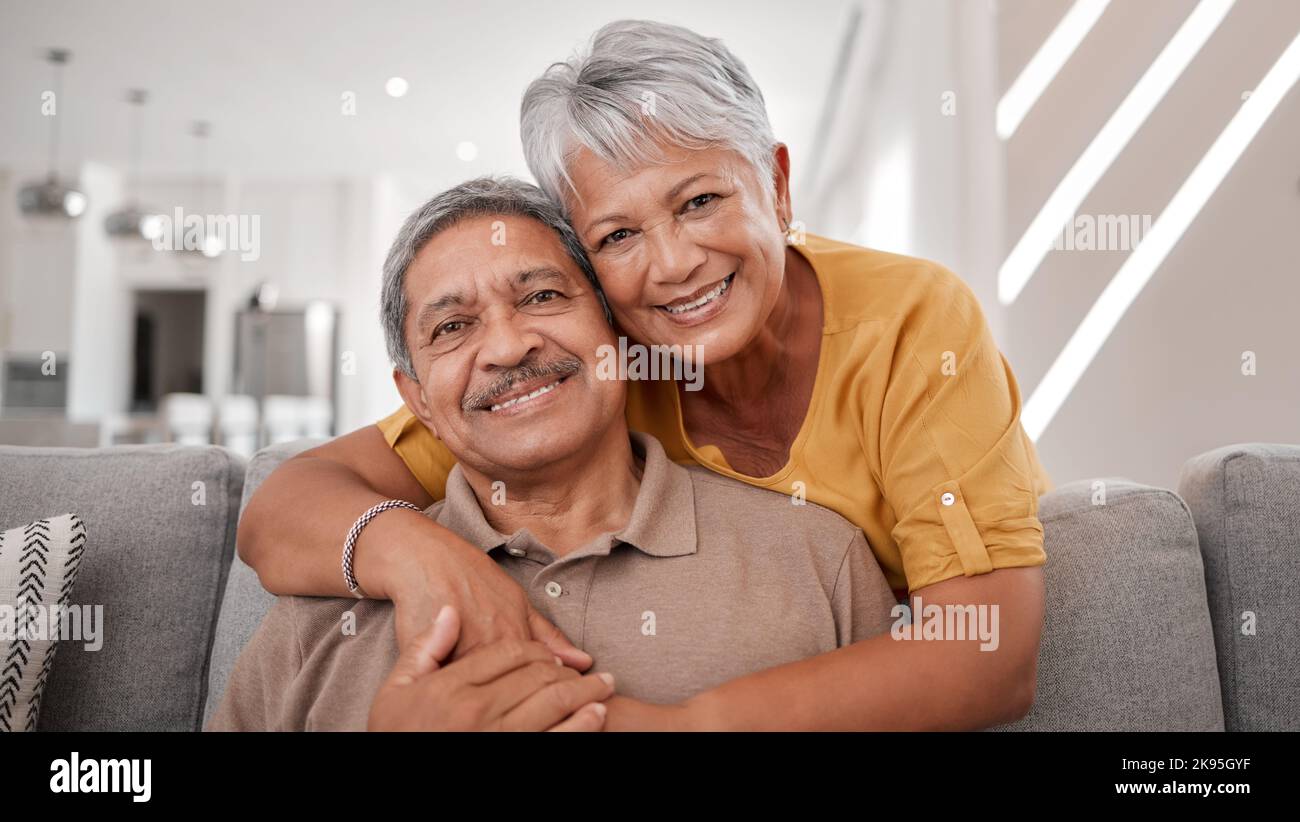 Portrait of elderly love, grandparents smile on sofa and old couple relax at home in happy retirement. Senior man, grandmother on couch and smile in Stock Photo