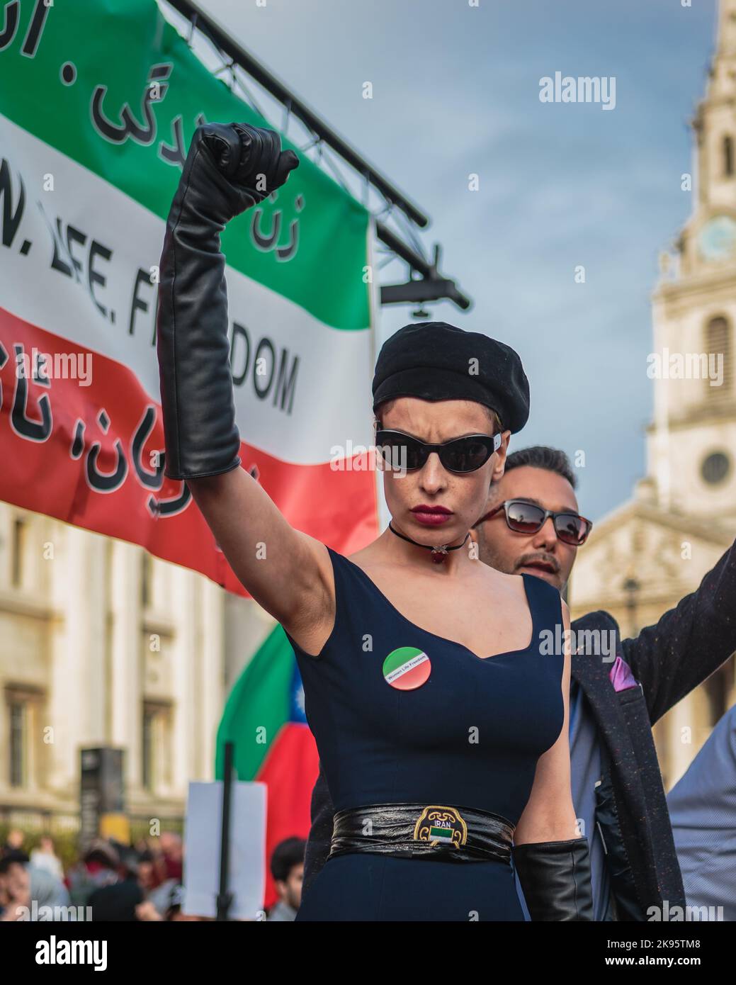 A women protester in London shows a fist of defiance against the Iranian regime. Stock Photo