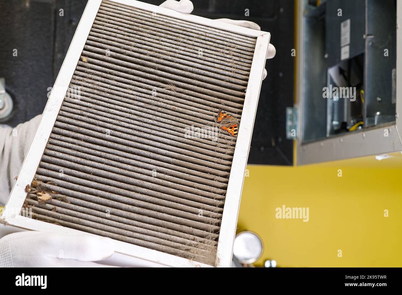 Replacing filter in the central ventilation system. hvac filter replacing home central air system Stock Photo