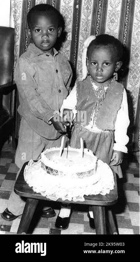 Undated family handout photo issued by the Metropolitan Police of a young Marvin with his sister Margaret celebrating her 2nd birthday. The heartbroken family of a man who lay in a hospital bed for 13 years before dying from gunshot injuries have described their emotional torment that his killer walks free. Issue date: Wednesday October 26, 2022. Stock Photo