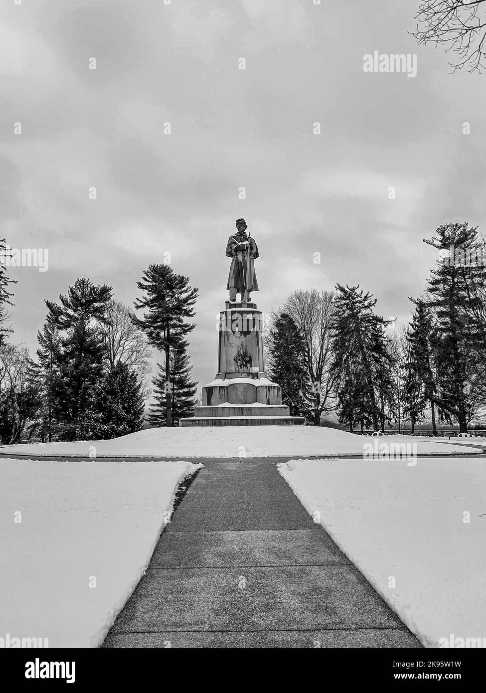 A grayscale shot of the Private Soldier Monument at the Antietam National Cemetery in Sharpsburg, Maryland, USA Stock Photo