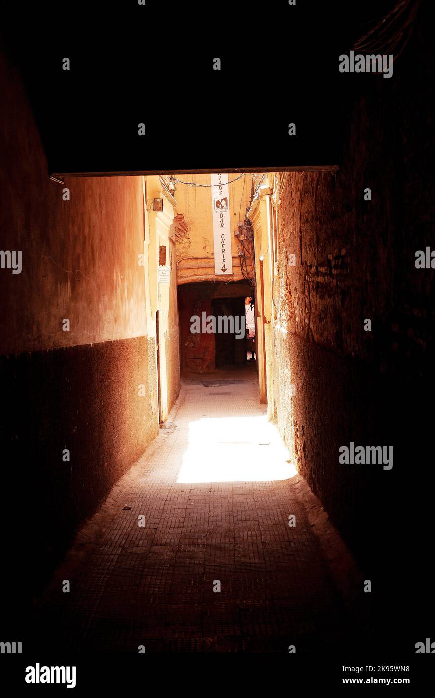 A vertical shot of a narrow street in Morocco Stock Photo - Alamy
