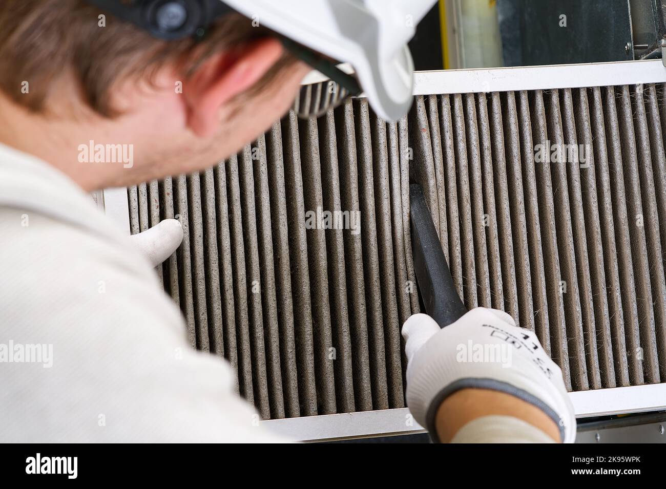 Replacing filter in the central ventilation system. hvac filter replacing home central air system Stock Photo