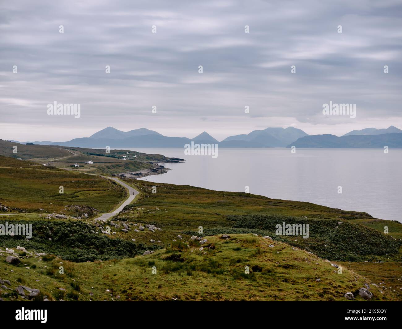 The viewpoint and coast road at Cuaig, Strathcarron looking across the sea to the Isle of Skye and its mountains on the west coast of Scotland UK Stock Photo
