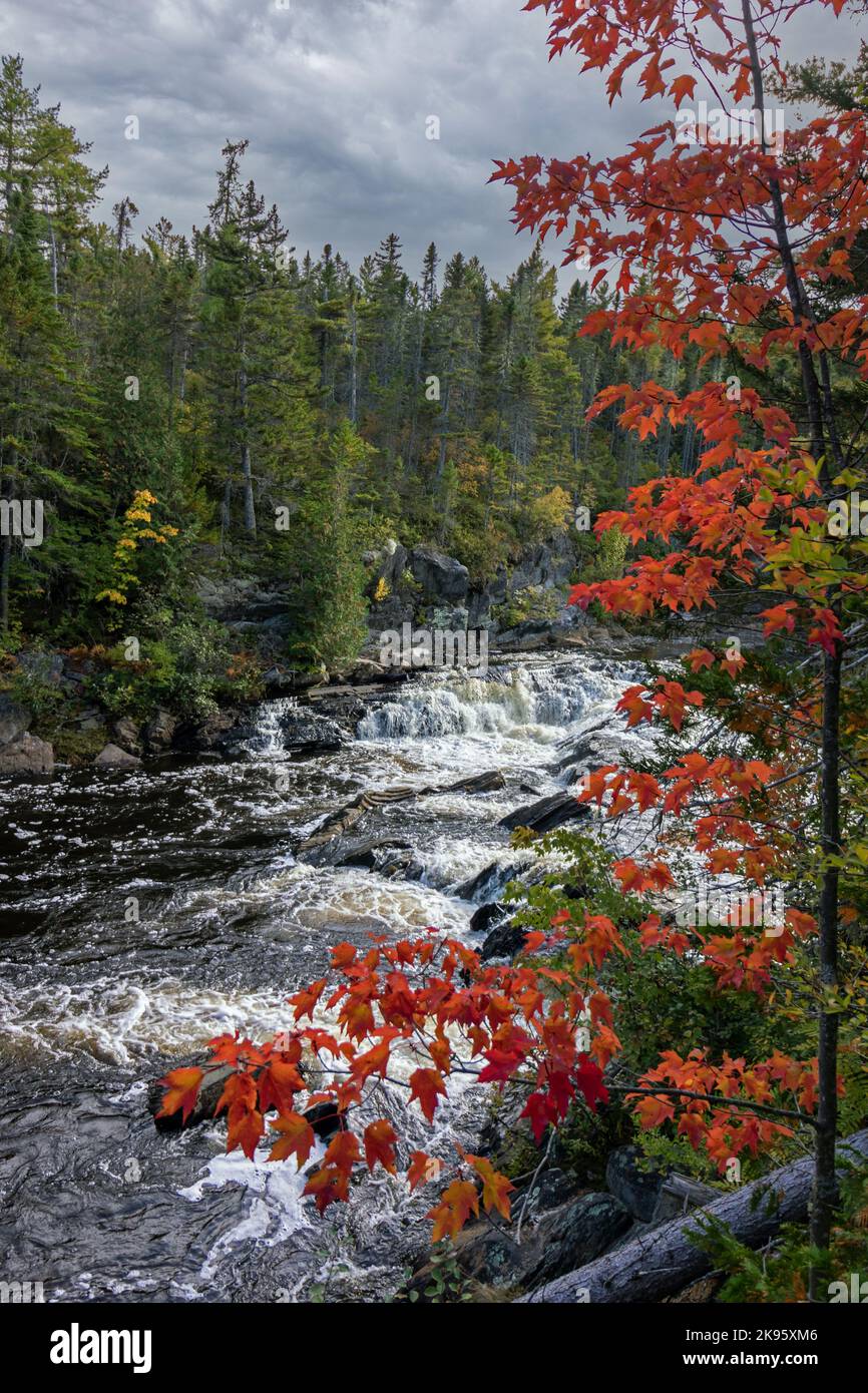 Waterfalls rush down the gorge at Gulf Hagas in the northern Maine Woods in early fall Stock Photo