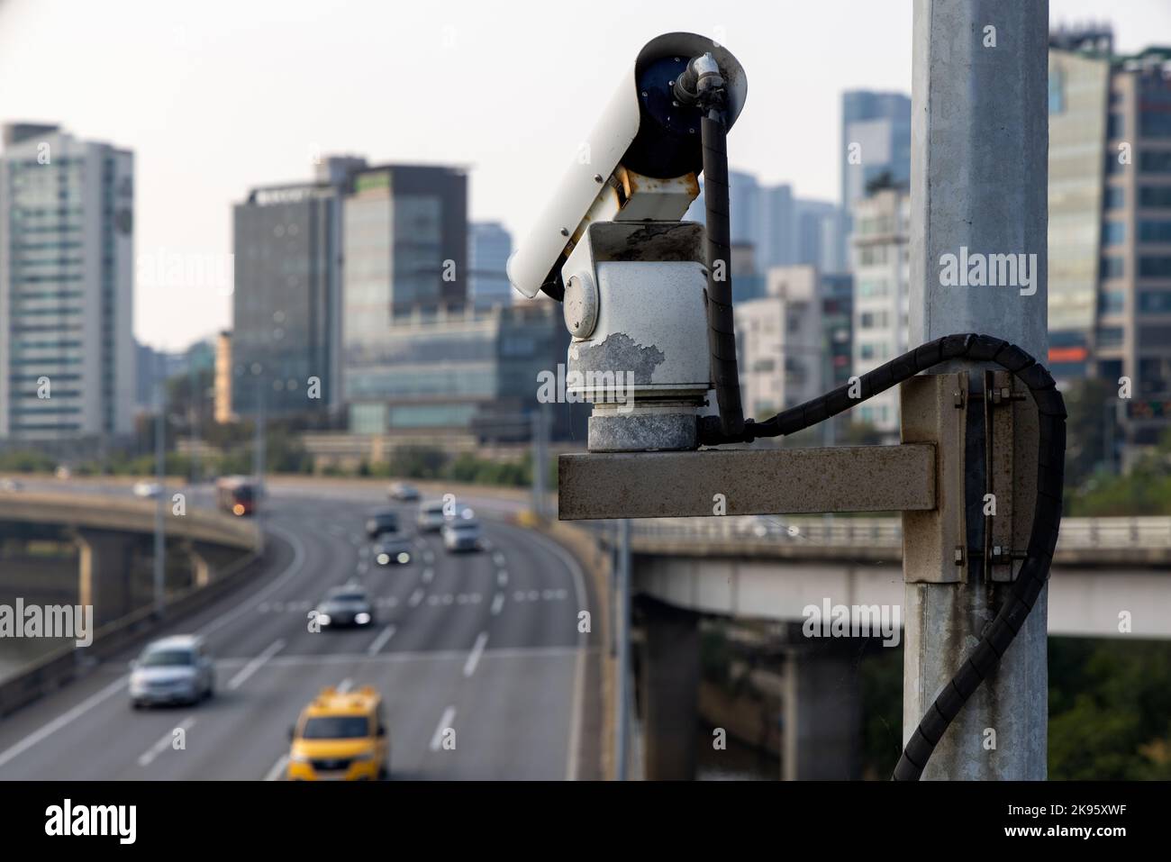 Security camera on the bridge watching after the car traffic, and speed
