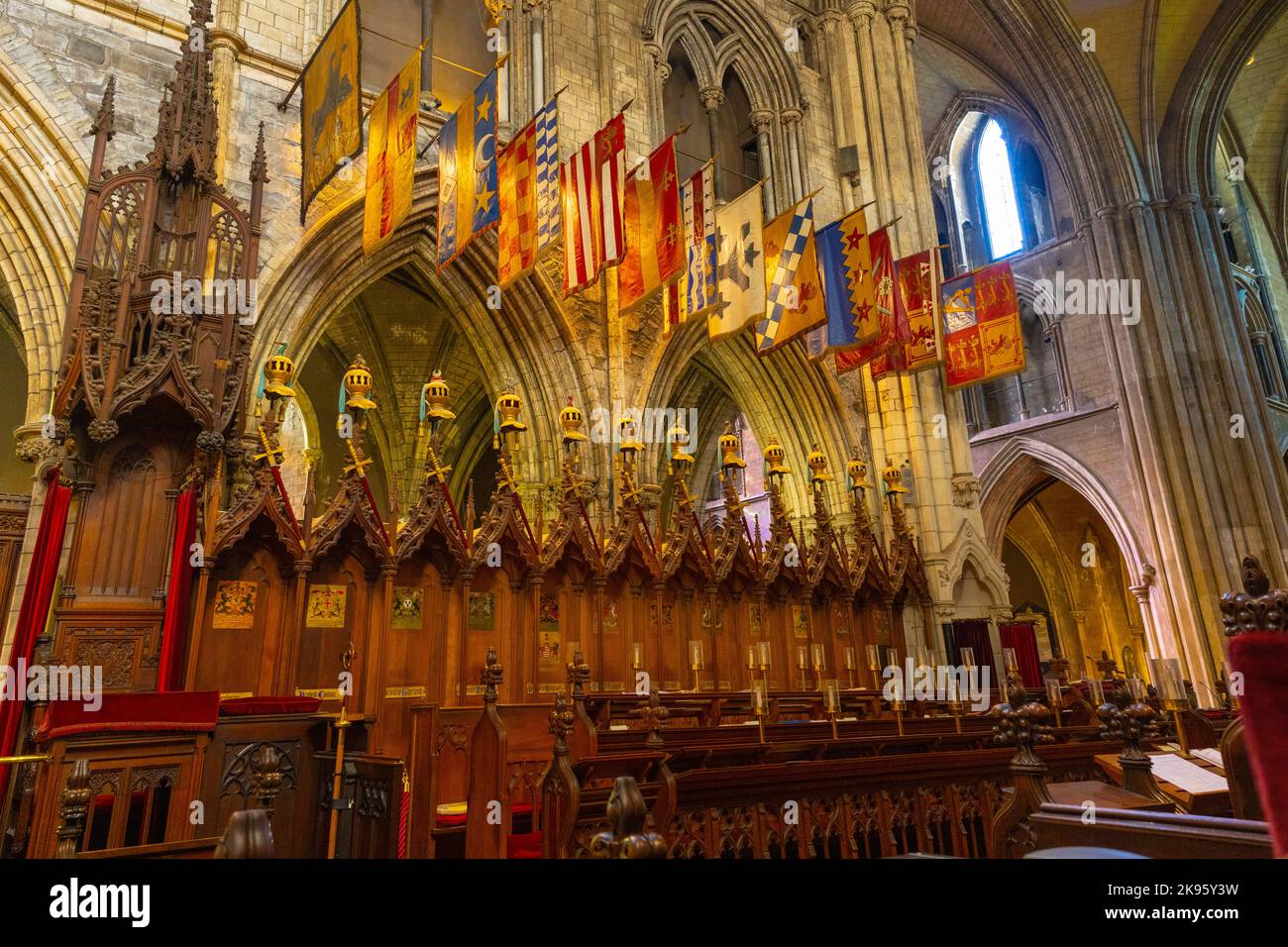 Ireland Dublin St Patrick's Cathedral Church of Ireland was Catholic founded 1191 Gothic choir stalls Knights of St Patrick heraldic banners flags Stock Photo