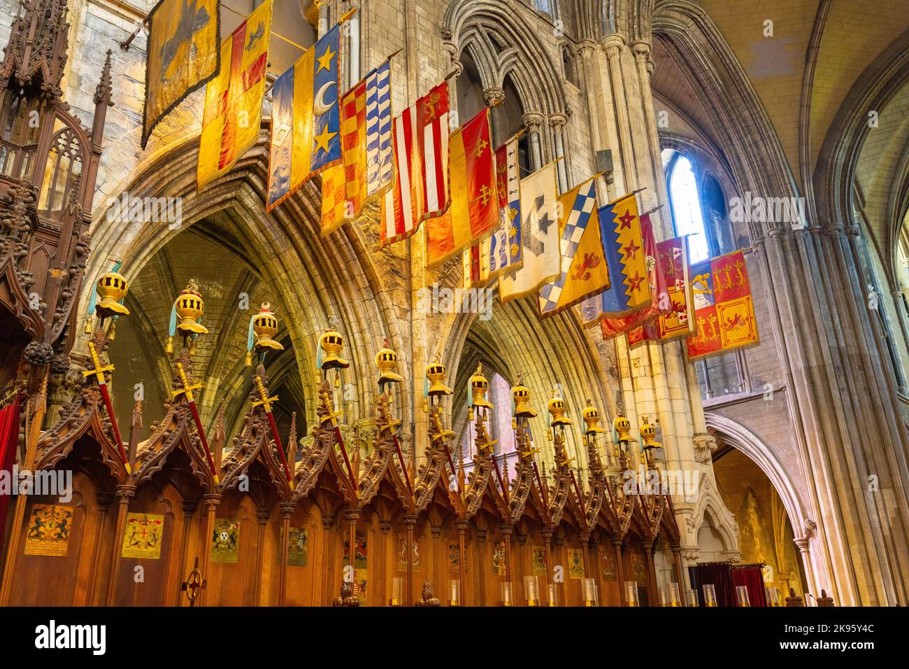 Ireland Dublin St Patrick's Cathedral Church of Ireland was Catholic founded 1191 Gothic choir stalls Knights of St Patrick heraldic banners flags Stock Photo
