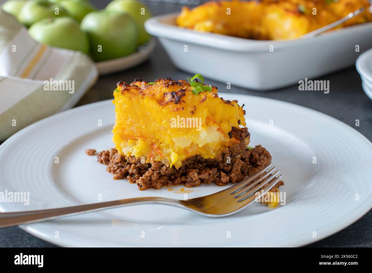 Ground beef with pumpkin and potato crust on a plate Stock Photo