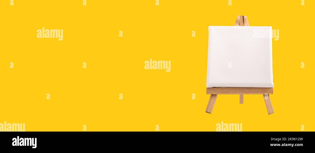 White blank square canvas mock up on wood easel. Art creative studio