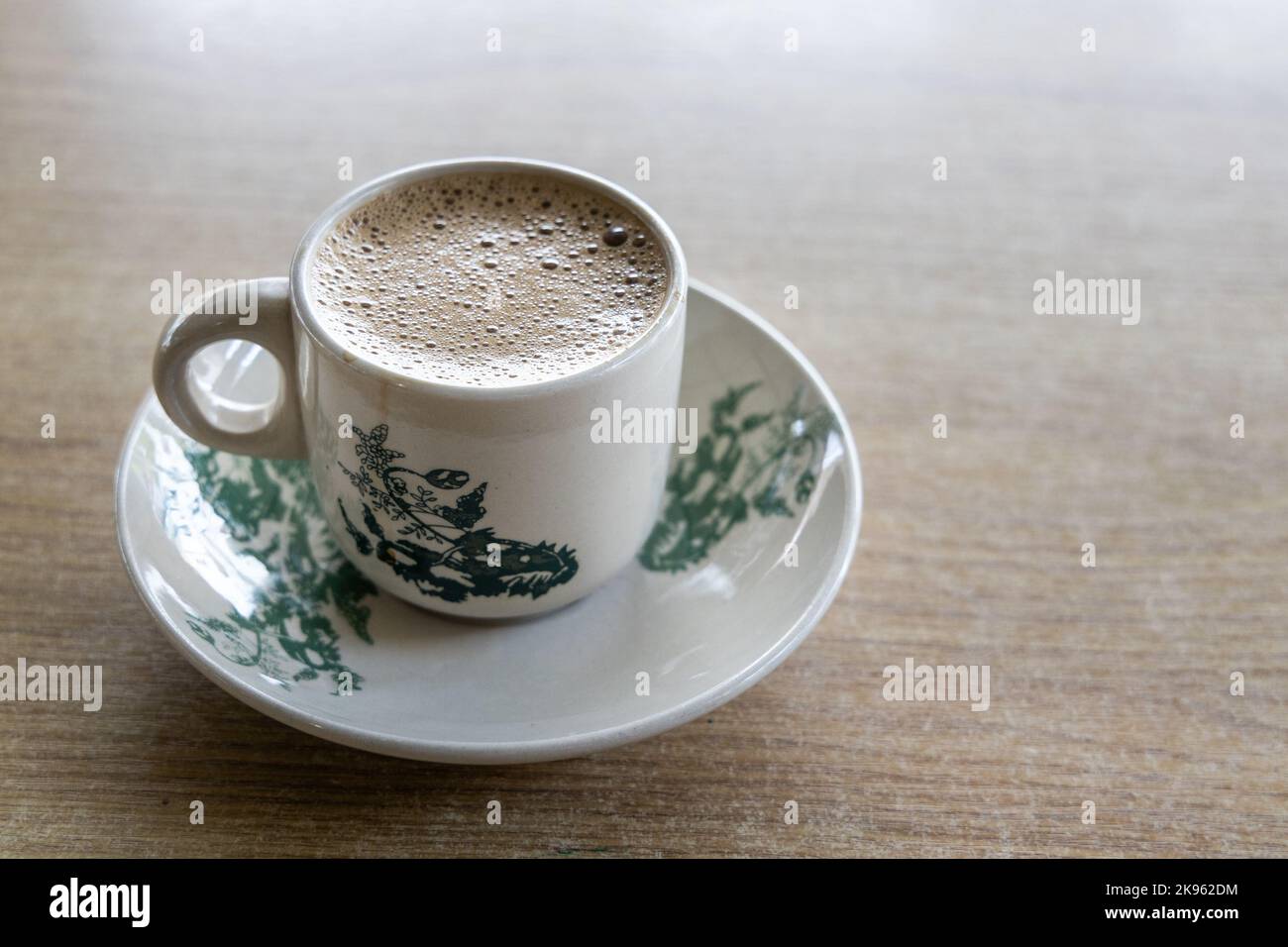 Tradiitional aromatic coffee served in vintage kopitiam cup and saucer Stock Photo