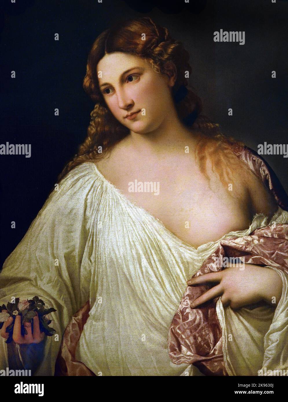 Flora, Titian,  (Pieve di Cadore 1488/90 – Venice 1576) , Florence, Italy. ( “Flora”, the nymph bride of Zephyr, whose story is Greek in origin, told to us by Ovid. ) Stock Photo