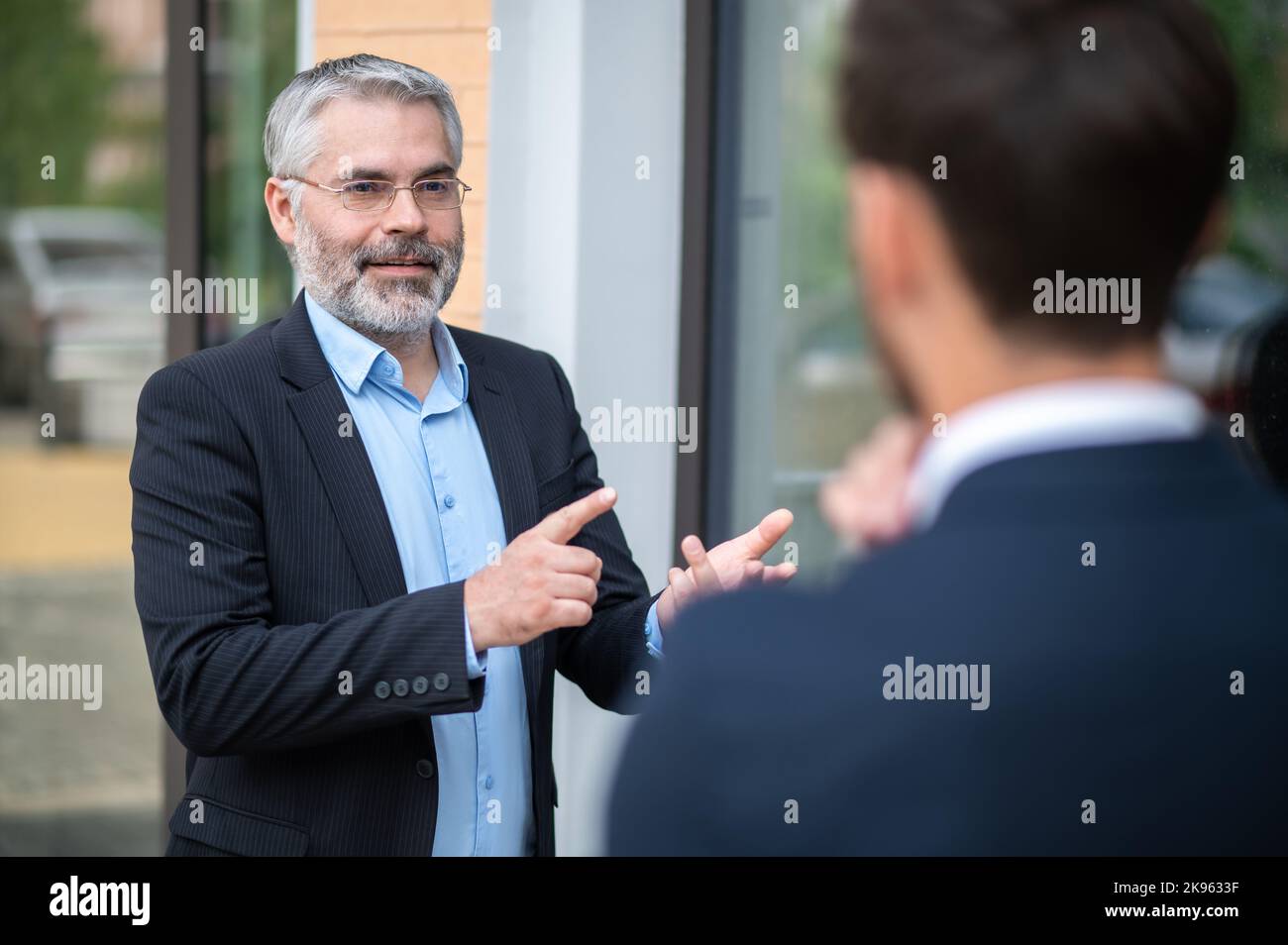 Two business partners having negotiations Stock Photo