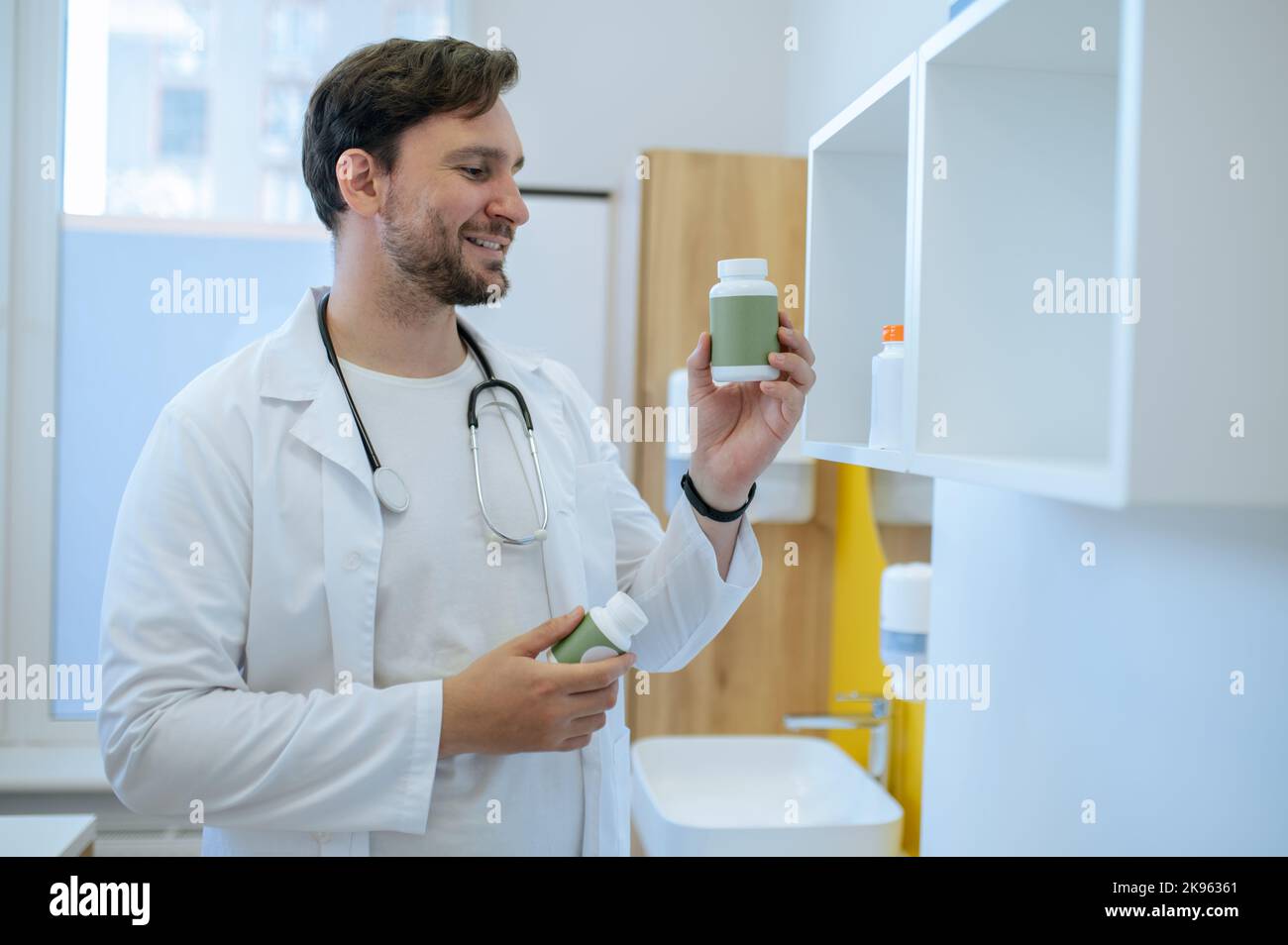 Healthcare professional checking the expiration date of dietary supplements Stock Photo Alamy