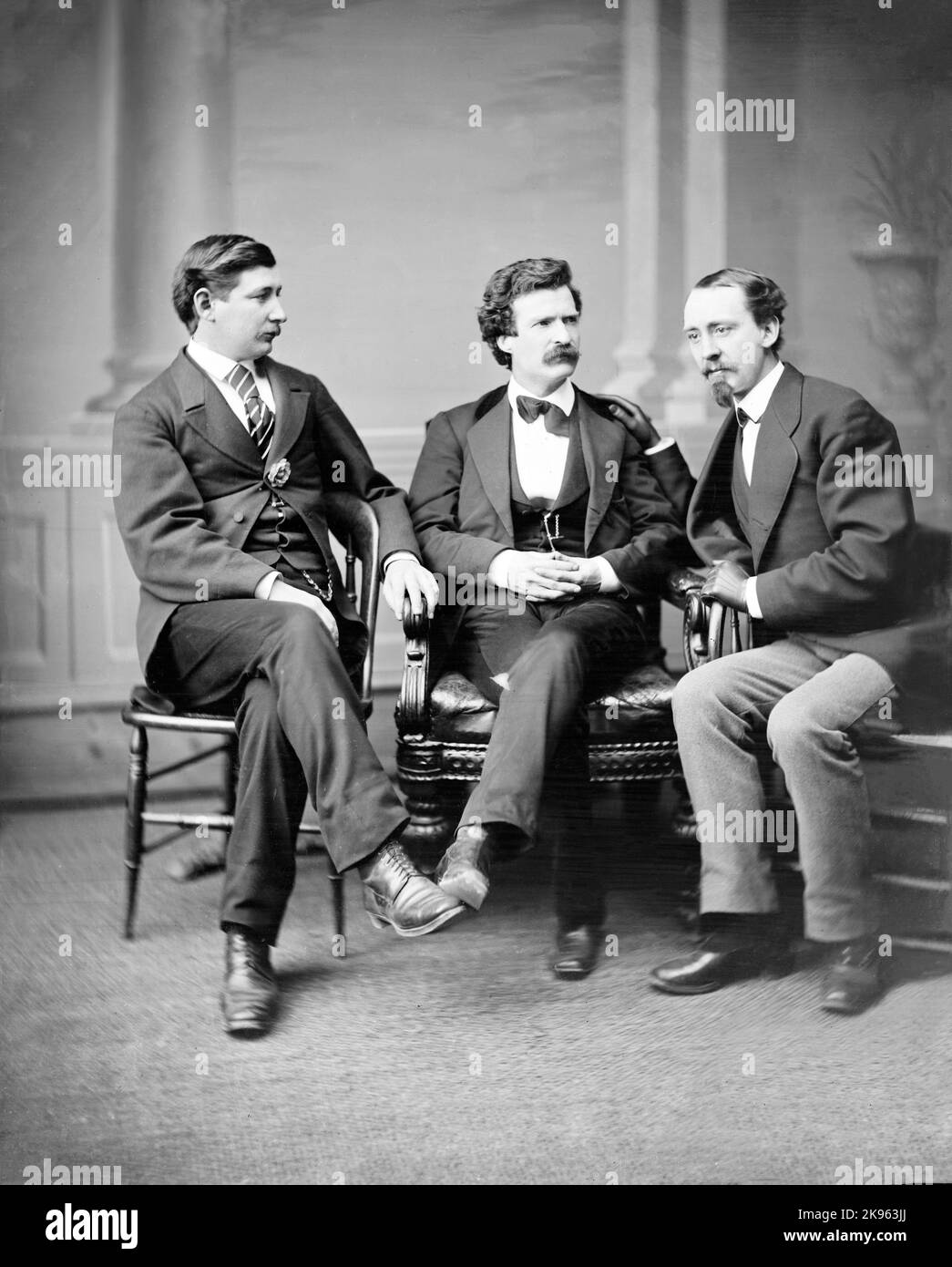 Mark Twain (Samuel L. Clemens) [center] George Alfred Townsend on [his] right, David Gray on [his] left in between 1860-1865 Stock Photo