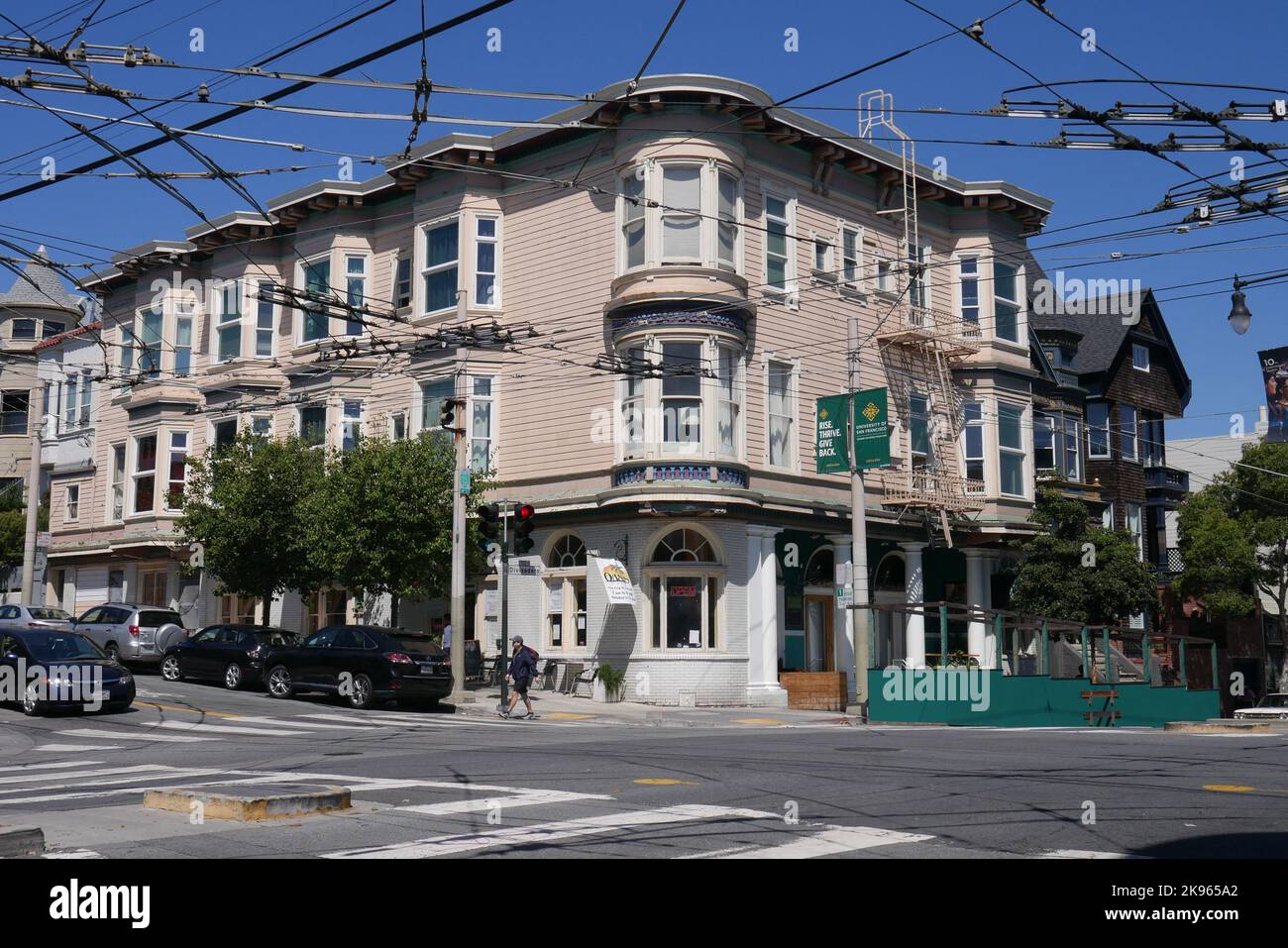 A view of the McCallister and Divisadero intersection in San Francisco, California, looking towards an apartment building with Oasis Cafe. Stock Photo