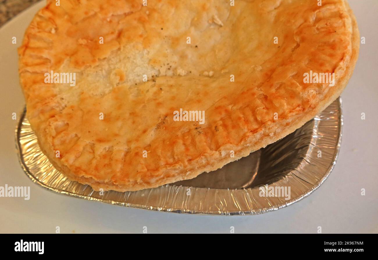 Wigan Lancashire Pie Burger, a steak or Meat pie on a oven bottom muffin Stock Photo