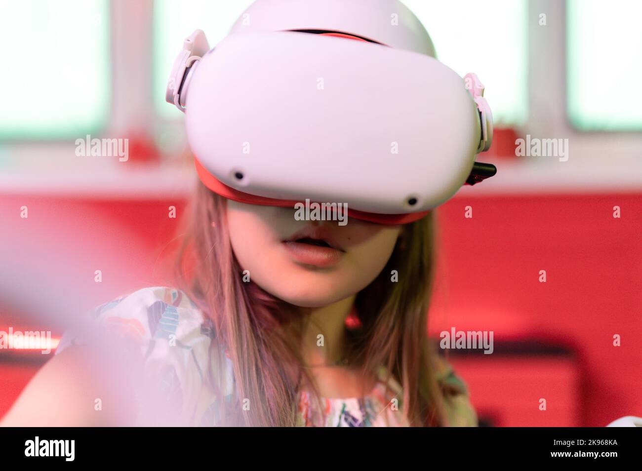 vr game and virtual reality. kid girl gamer eight years old fun playing