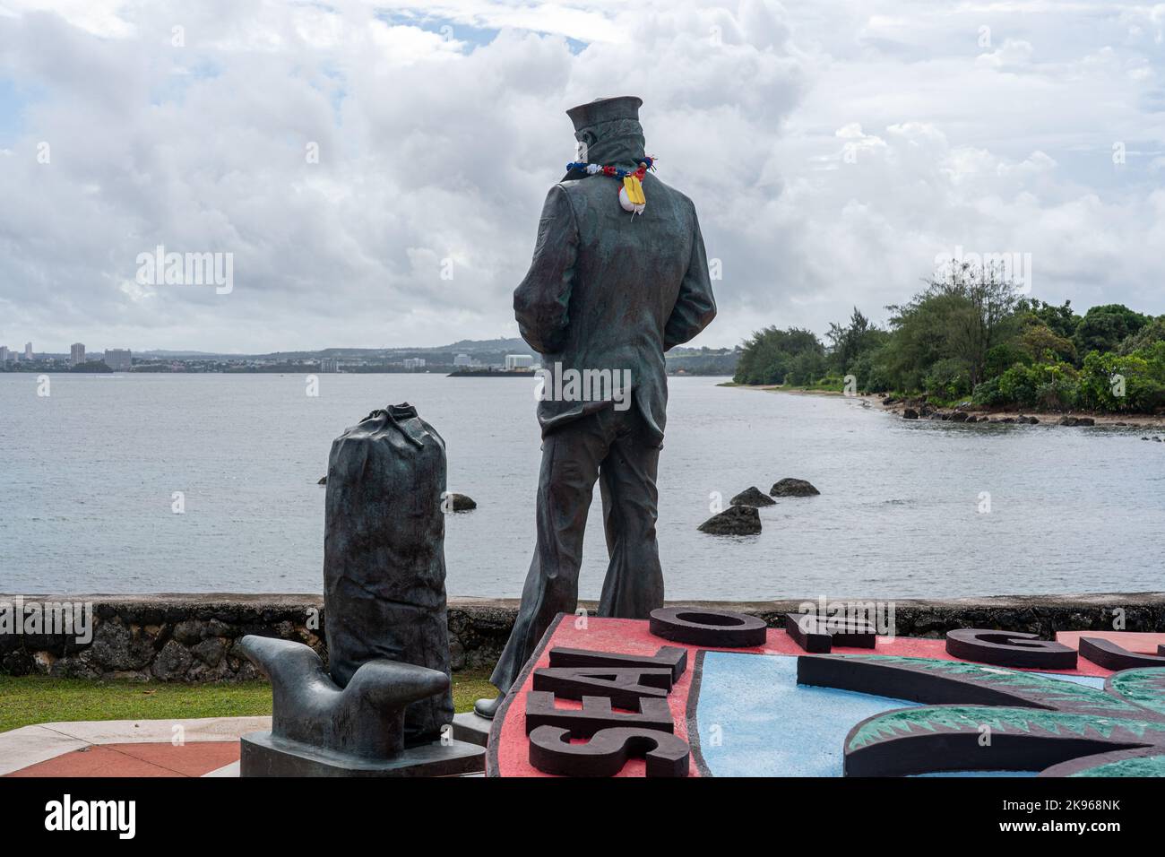 The Lone Sailor statue looking across the Pacific Ocean from the island of Guam Stock Photo