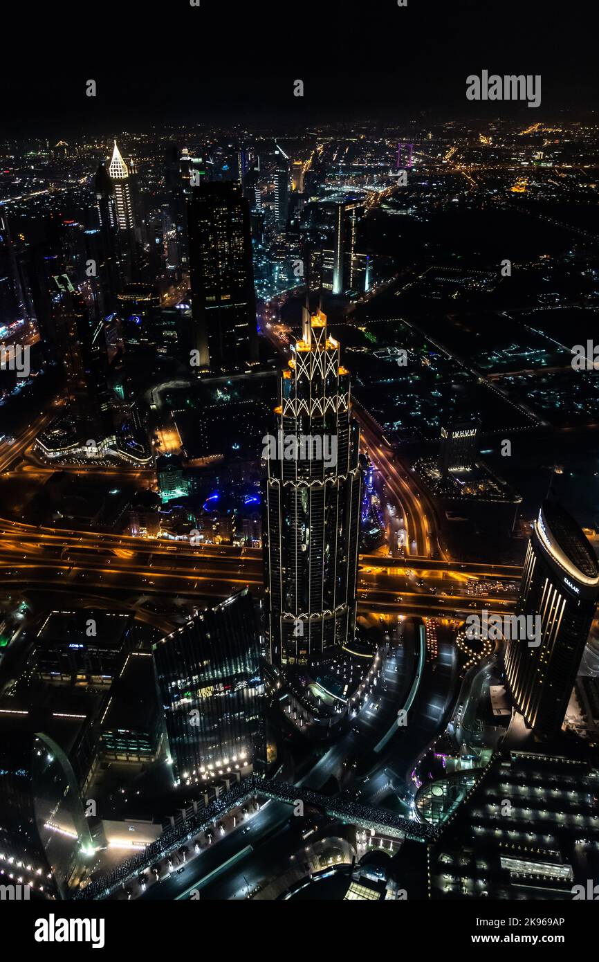 A vertical shot of the famous illuminated Burj Khalifa skyscraper in