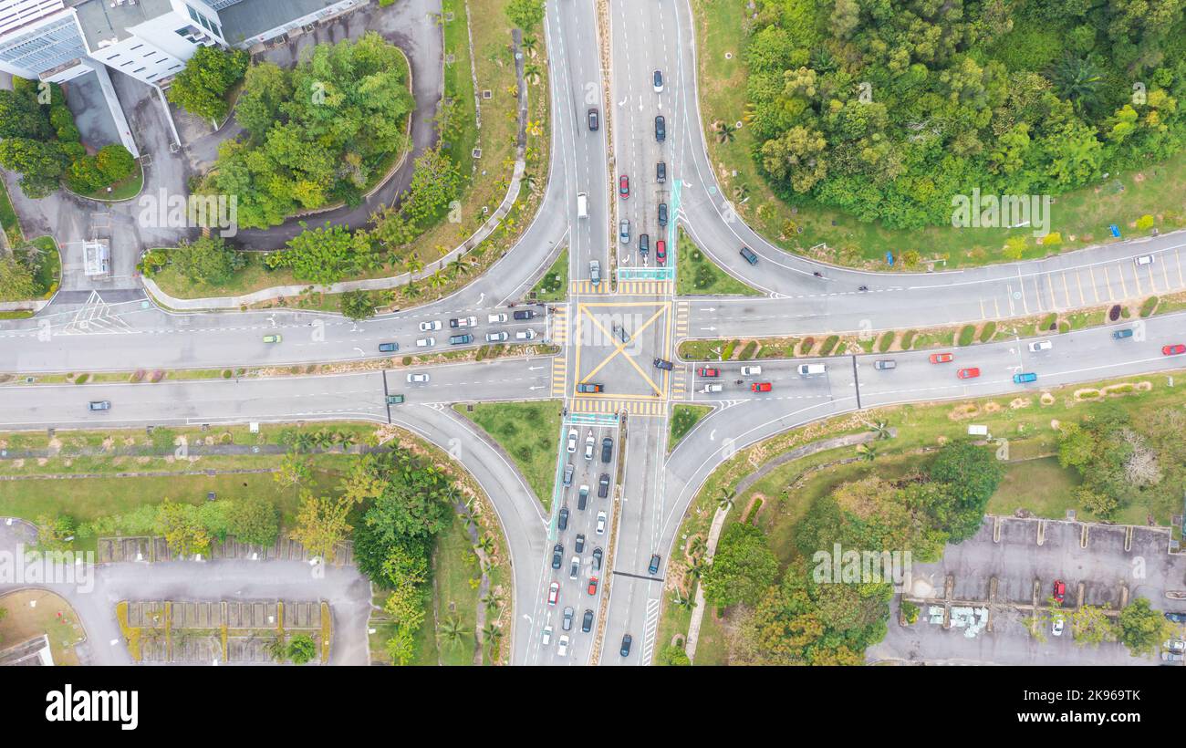Traffic junctions, modern city. View from above to busy road junction