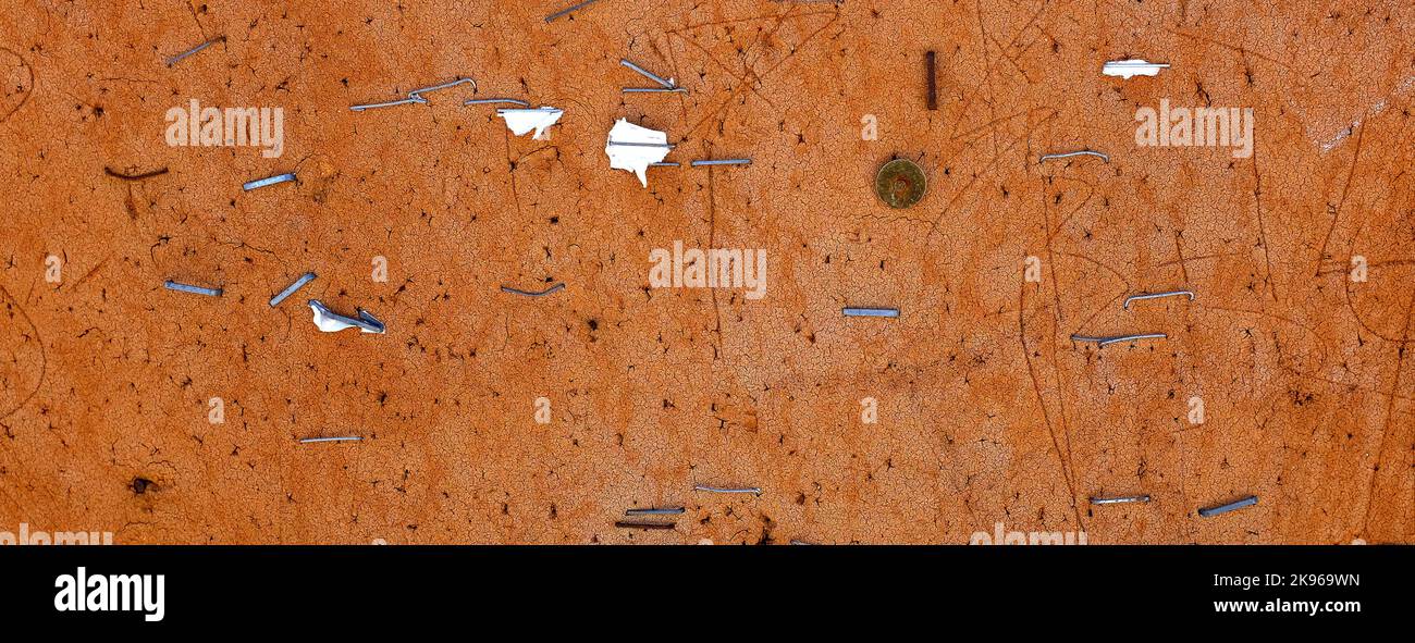 Old worn bulletin cork board with staples stock photo alamy