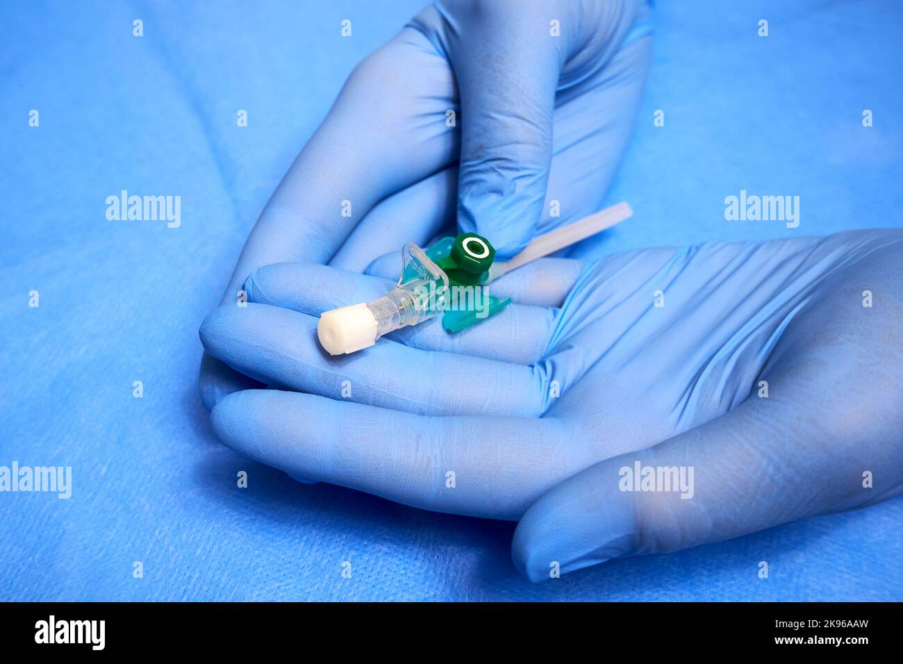Intravenous catheter in the hands of a medic closeup Stock Photo Alamy