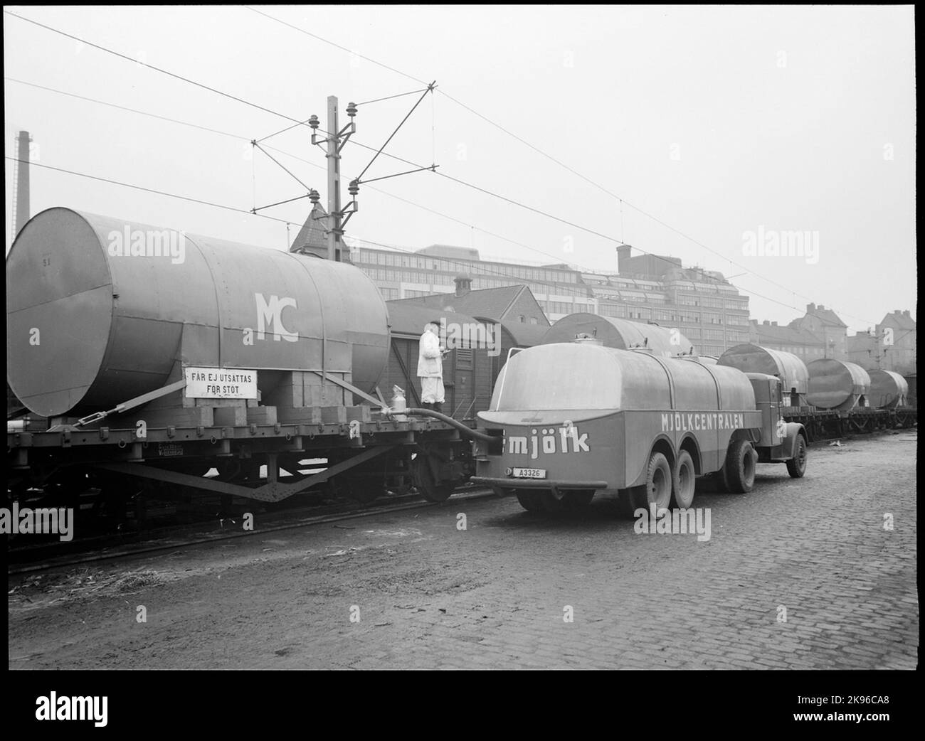 The estate yard at Stockholm Södra. Tapping of milk, from the cistern on a truck to truck tank, the milk center. Stock Photo
