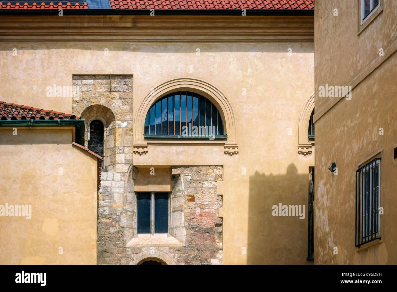 External view of the walls of the courtyard with windows of various configurations. Stock Photo