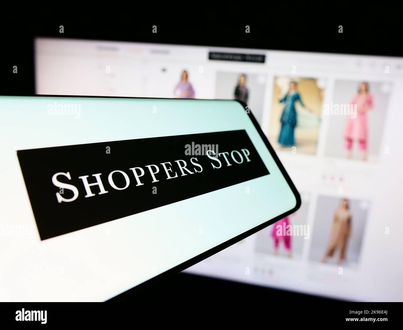 Smartphone with logo of Indian retail company Shoppers Stop Limited on screen in front of business website. Focus on center of phone display. Stock Photo