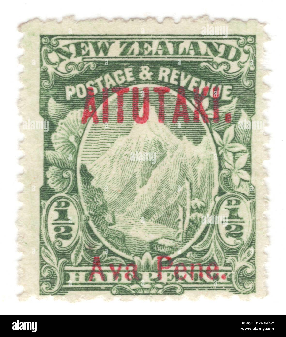 AITUTAKI - CIRCA 1903: An ½ pence green postage stamp depicting Mount Cook. Stamp of New Zealand overprinted 'AITUTAKI' and value in native language in Red Stock Photo