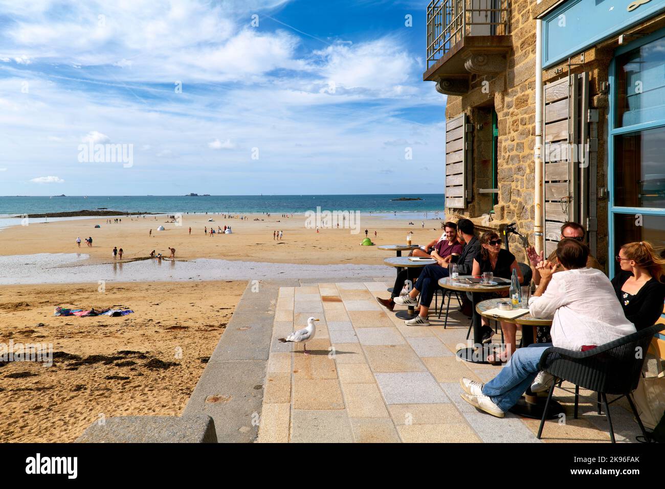 Saint Malo Brittany France. People relaxing at a cafe at Grand Plage du Sillon Stock Photo