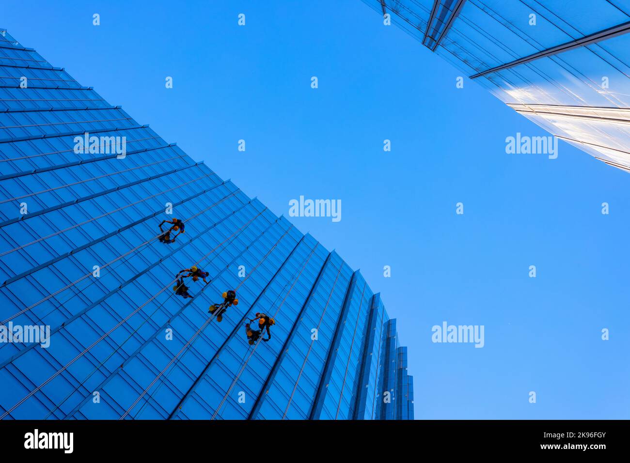 Warsaw, Poland July 3, 2022 Skyscraper high altitude facade cleaning