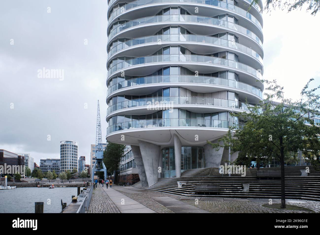 Hamburg, Germany - Sept 2022:  Oval shaped residential tower Oval Am Kaiserkai 10 in Hafencity designed by Ingenhoven Architekten Stock Photo
