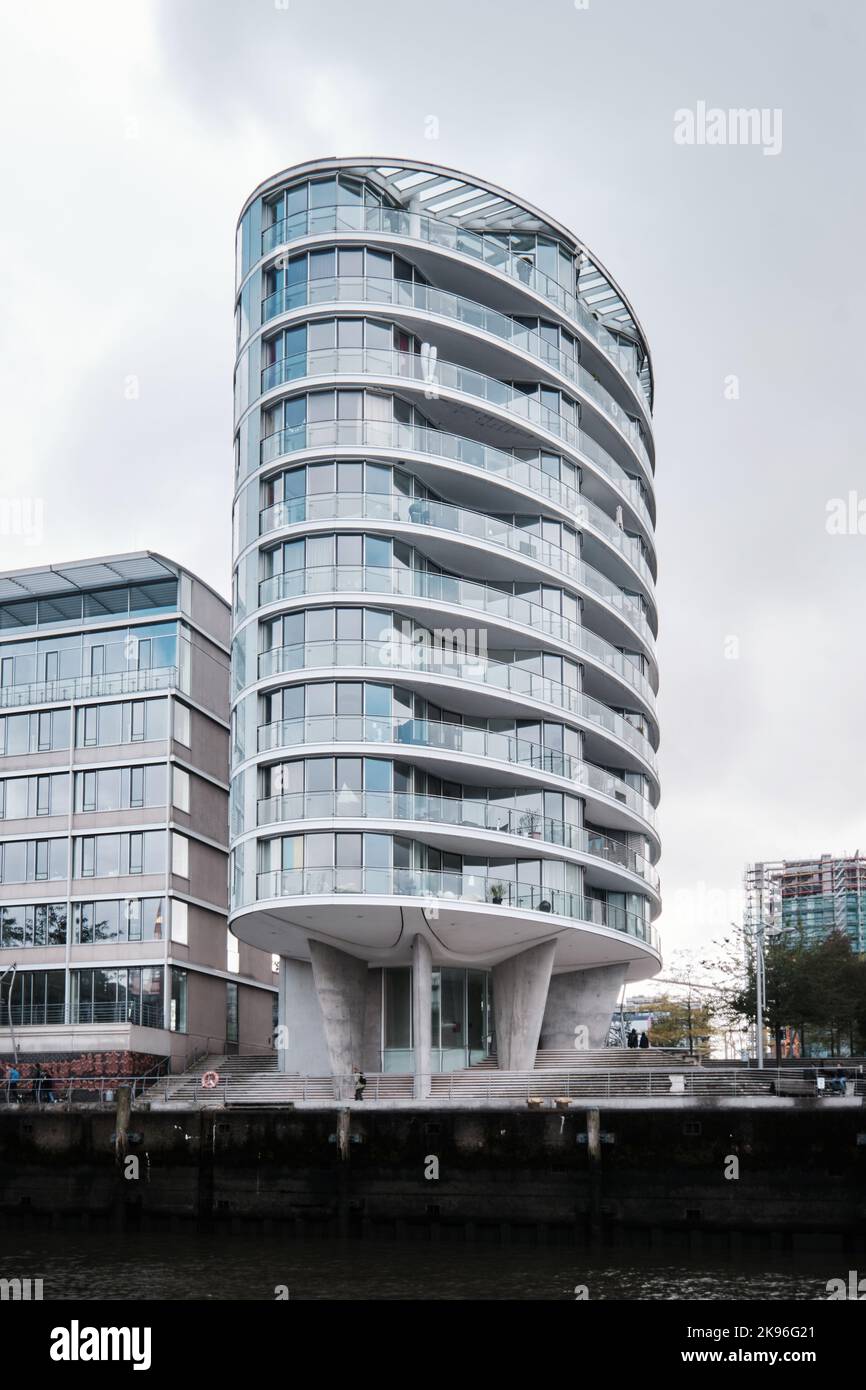 Hamburg, Germany - Sept 2022:  Oval shaped residential tower Oval Am Kaiserkai 10 in Hafencity designed by Ingenhoven Architekten Stock Photo
