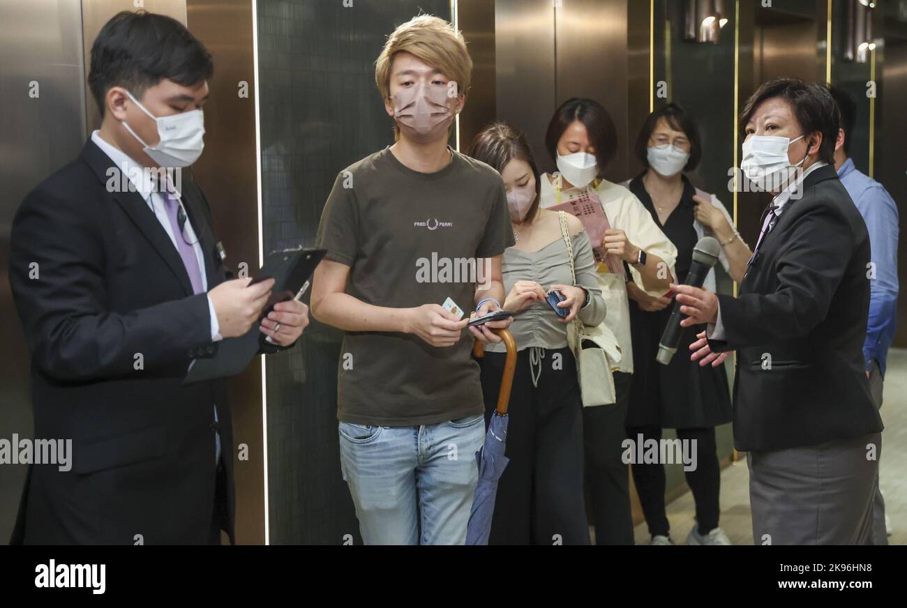 Potential buyers line up at the sales office of Henderson Land