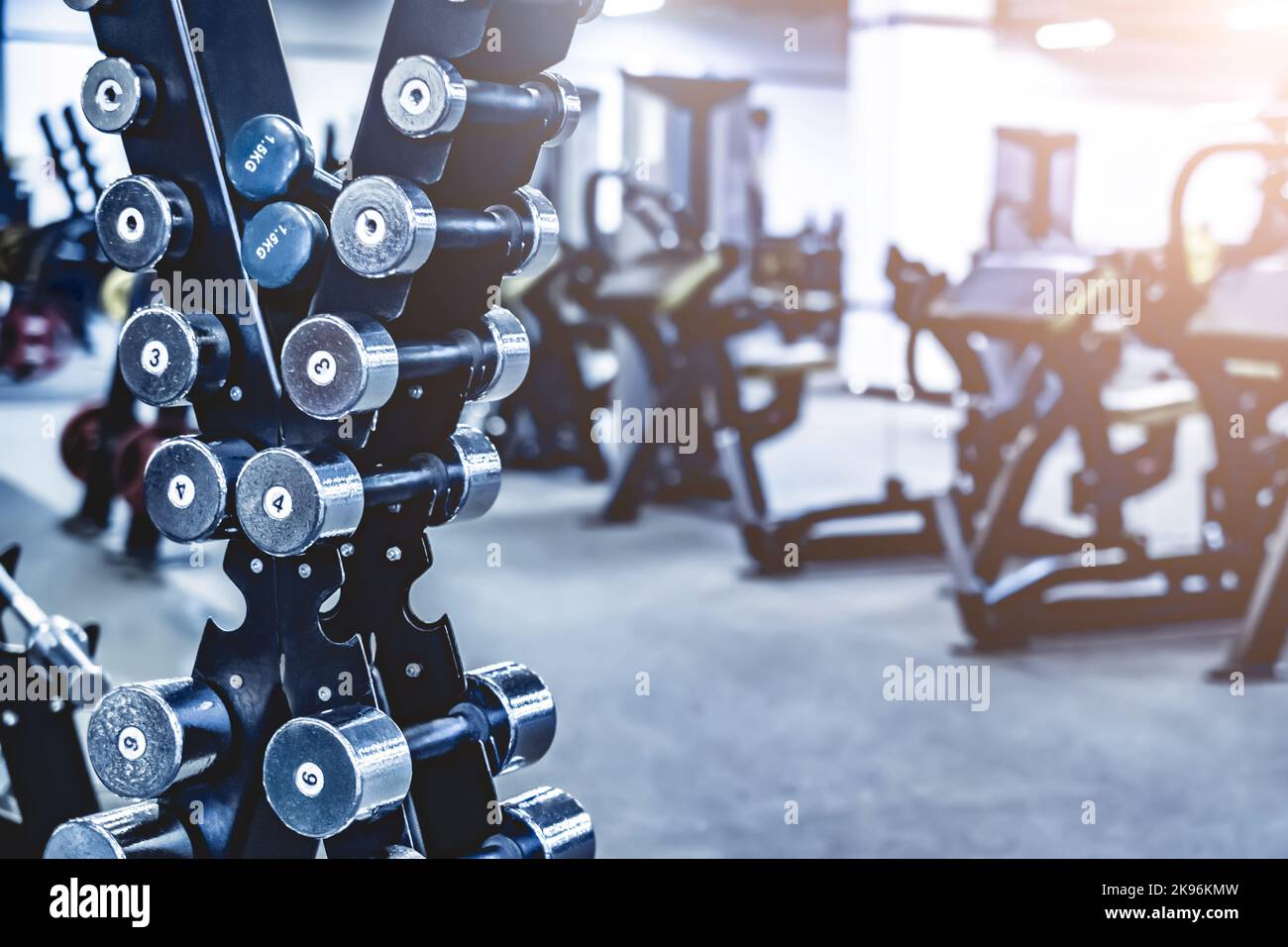 rows with a set of dumbbells Stock Photo - Alamy