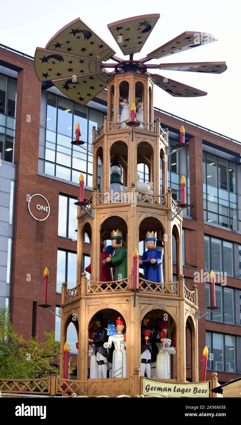 Wooden structure on top of a beer outlet as part of Manchester Christmas Market 2022, in Piccadilly Gardens, Manchester, England, UK, opening November 10, 2022. It features festive figures holding bells to ring in celebration of the Xmas season. Stock Photo