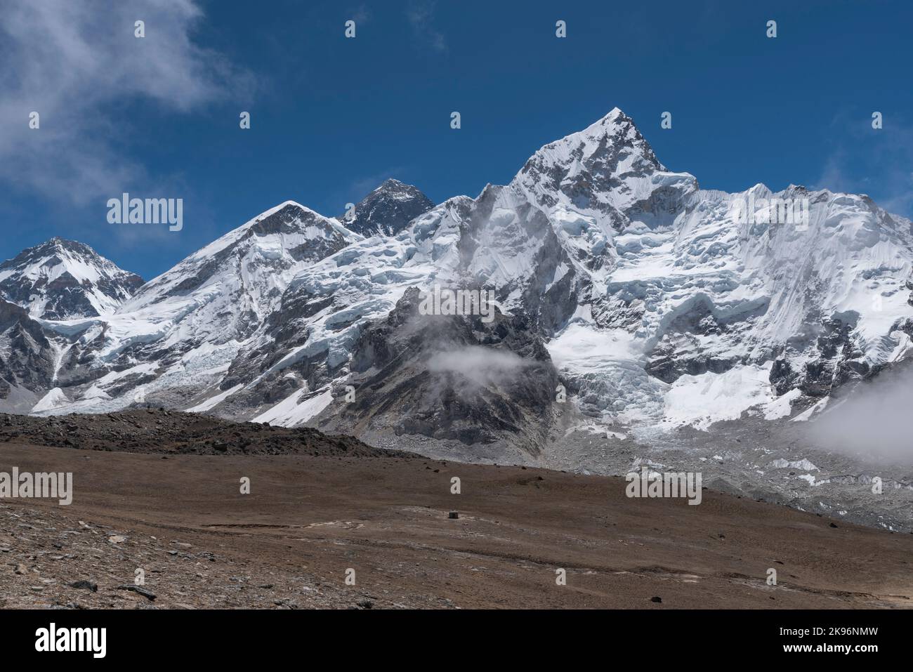 The white clouds and the mountain peaks covered by snow Stock Photo - Alamy