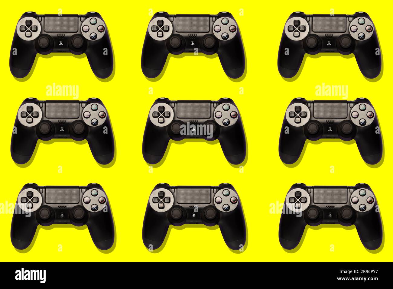 top view of playstation joypads on a colourful background, repetition, pattern, pop, professional studio shot, gaming, gamers, players Stock Photo