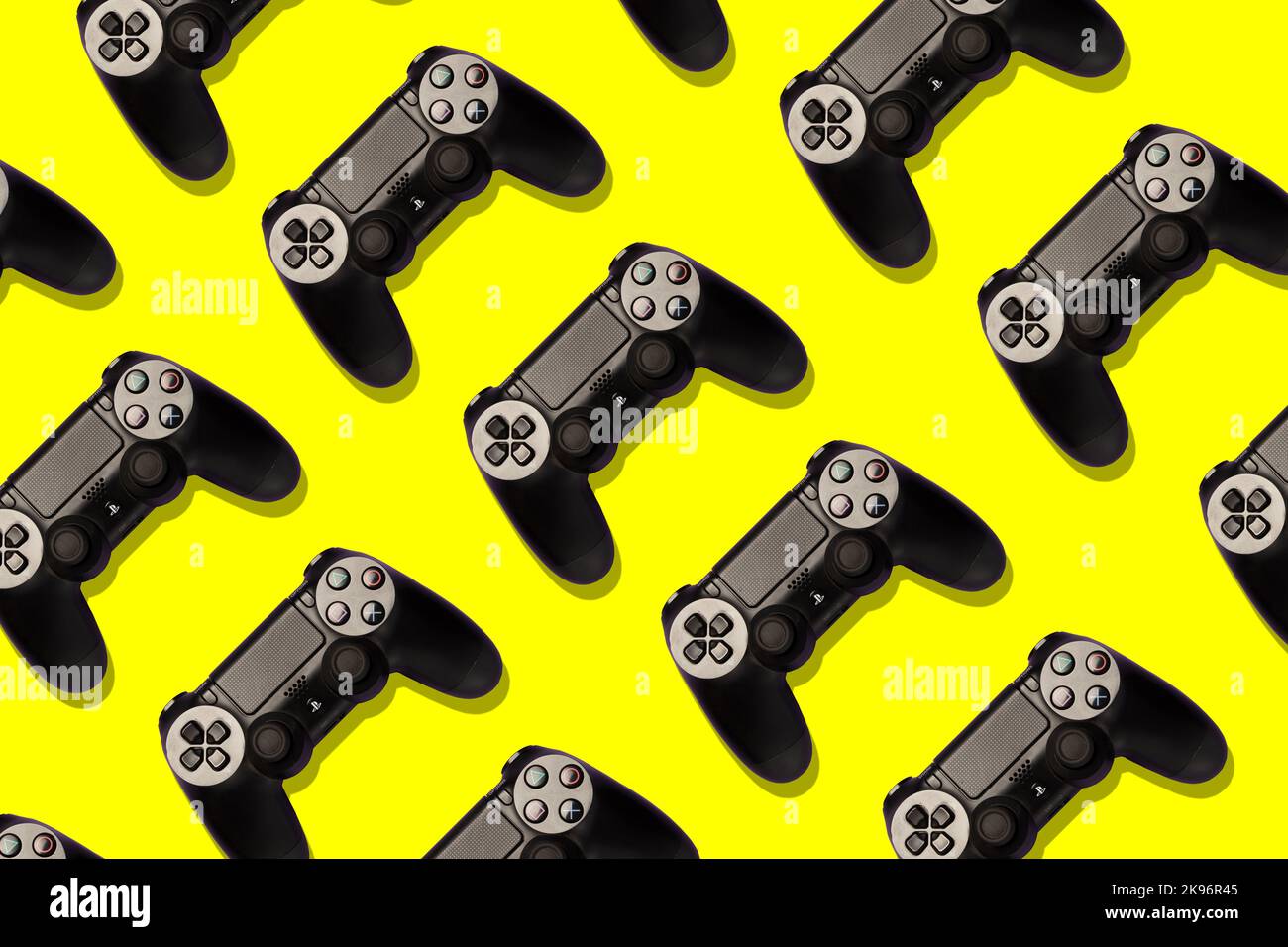 playstation joypads on a colourful background, repetition, pop, professional studio shot Stock Photo