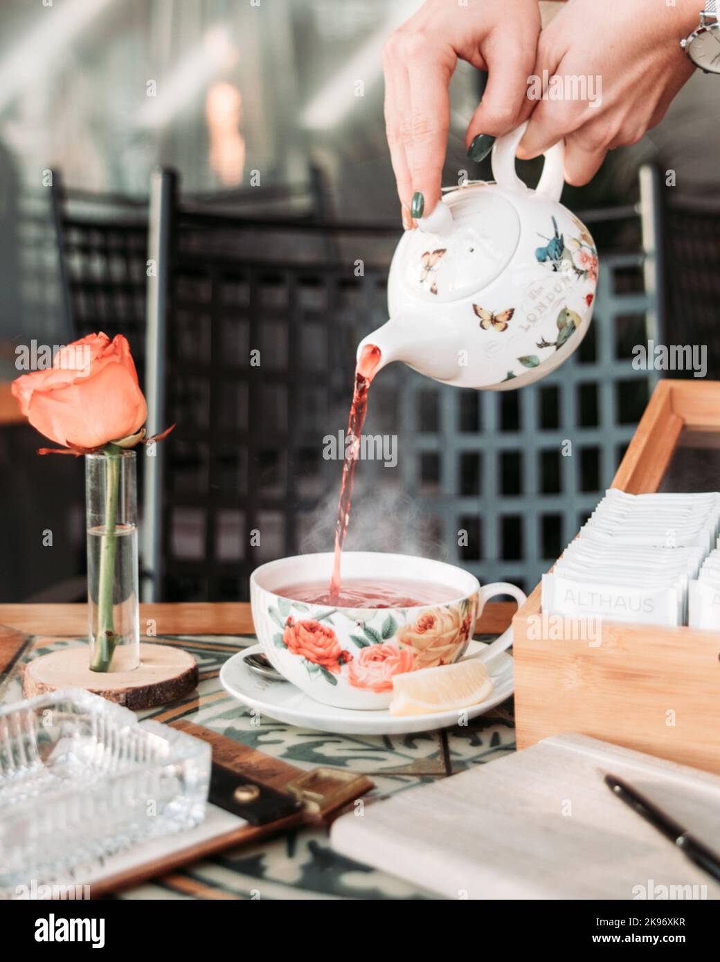 Serving fresh tea in vintage crockery at the cafe Stock Photo