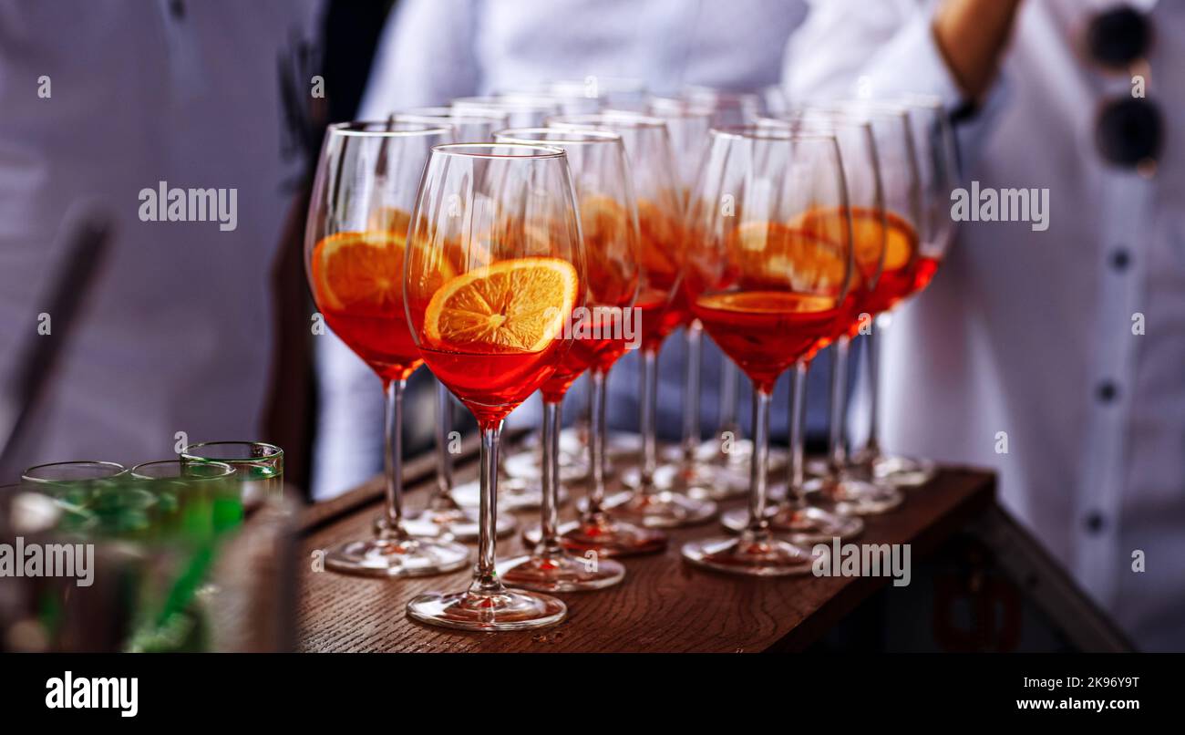 Glasses of alcoholic Aperol Spritz cocktail. Italian aperitif with ice