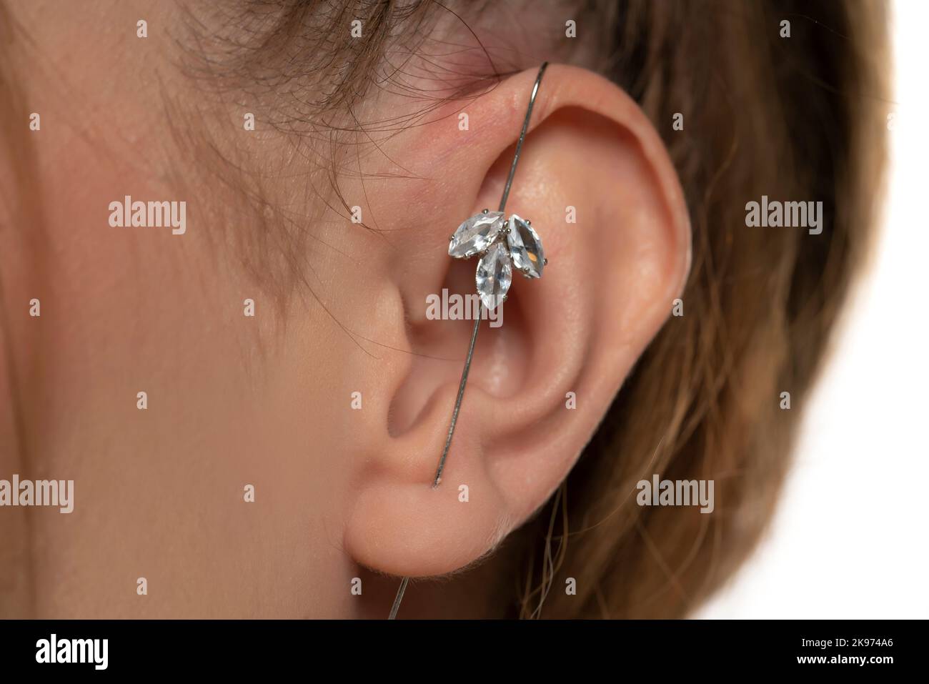 female ear piercing without drilling the helix.. Stock Photo