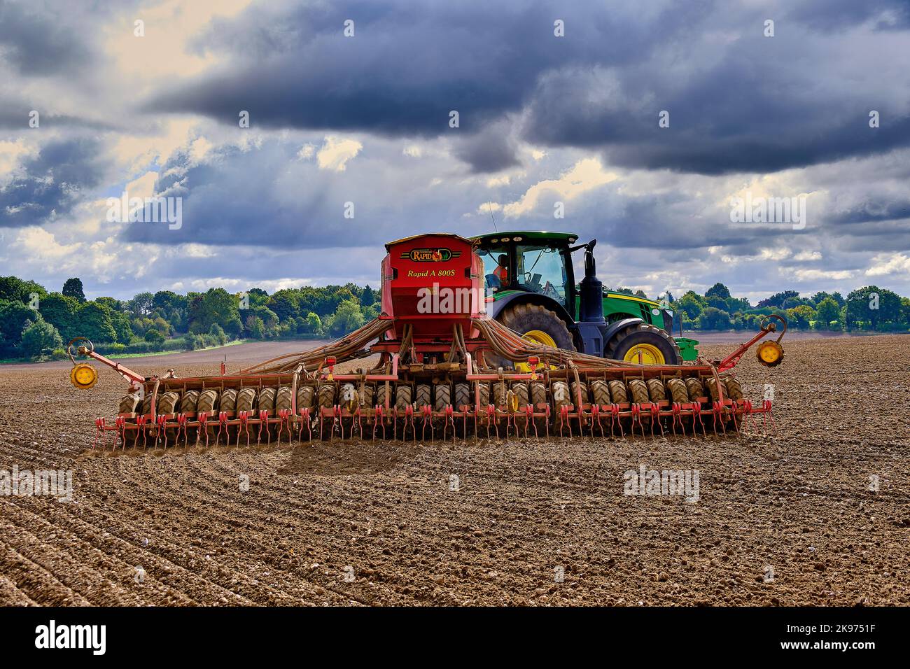 Seed drilling on agricultural farm Stock Photo