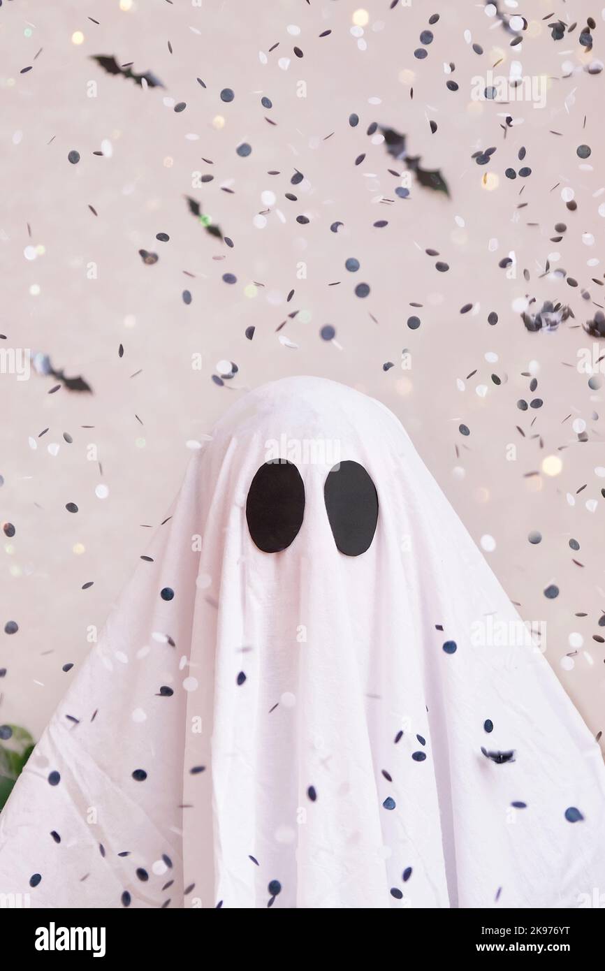 White ghost costume for Halloween party with neon lights in the