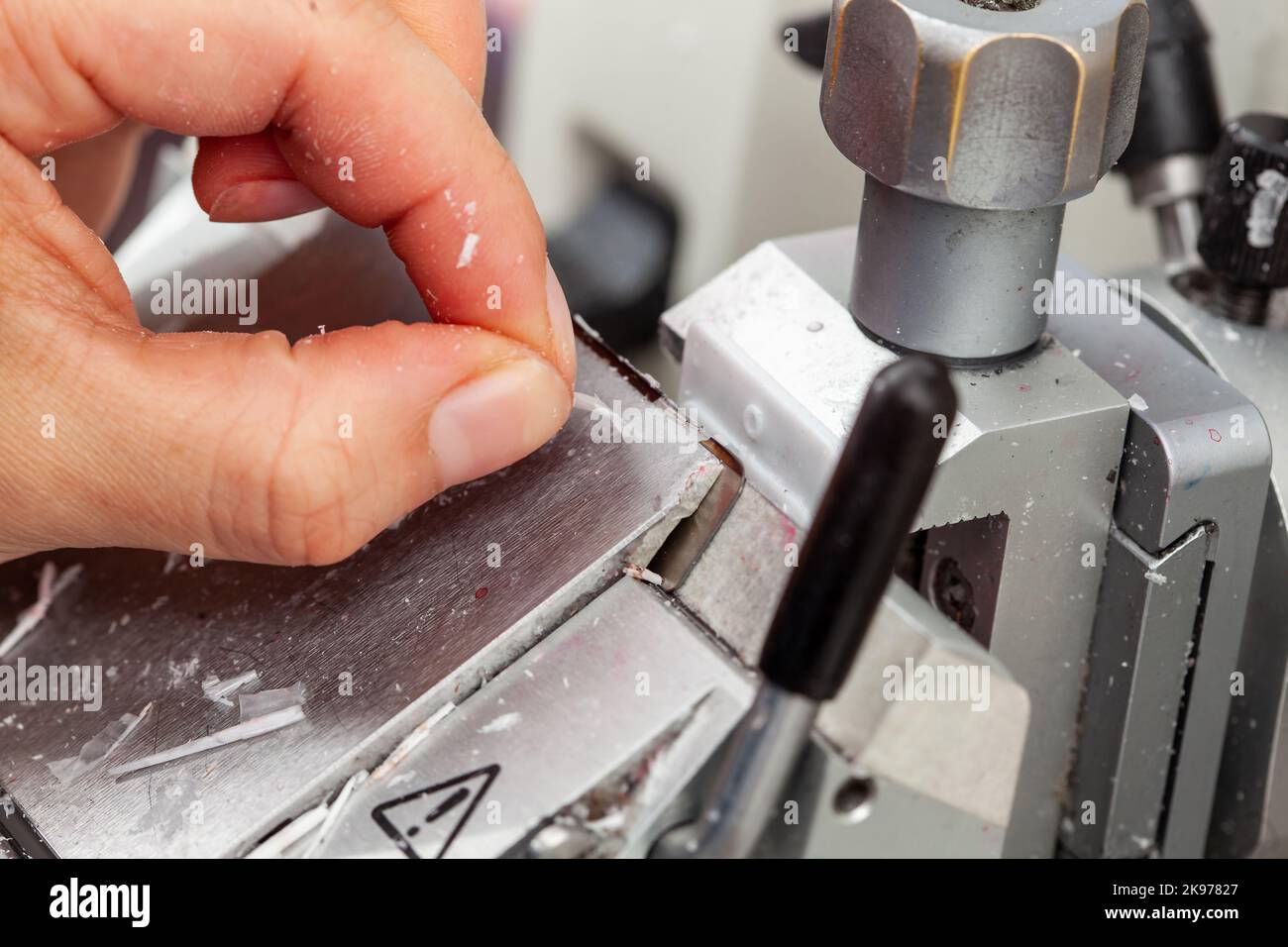 Closeup to the scientist hands working on a rotary microtome to obtain