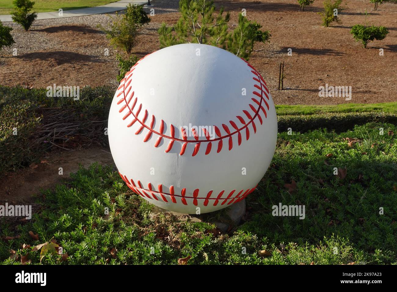 A concrete baseball for public sports park landscaping. Stock Photo